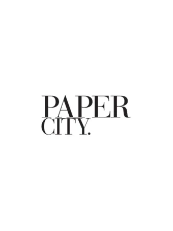 The image shows the text "PAPER CITY." in a bold serif font with a clean, modern look.