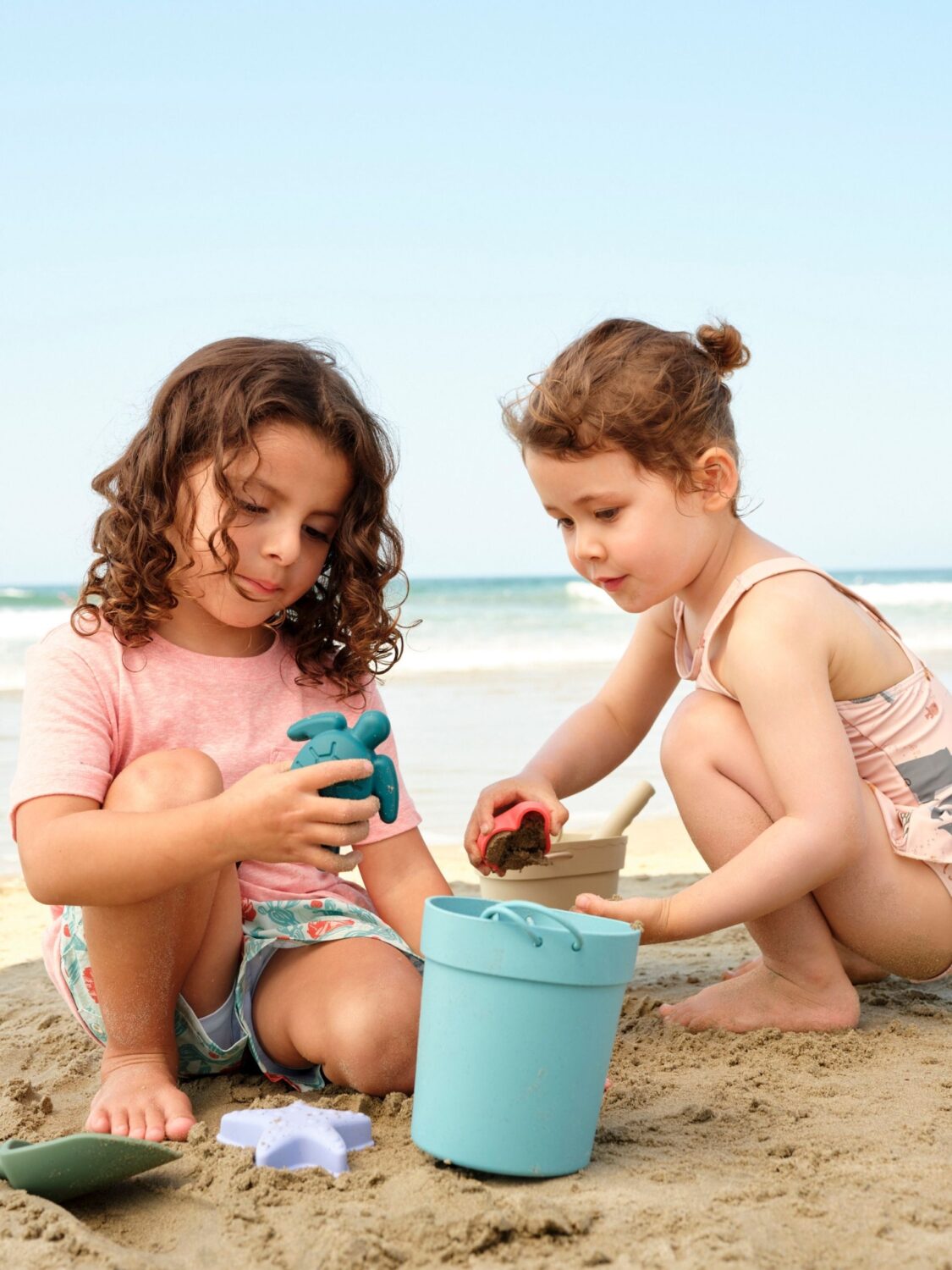 Children playing on the beach near Shutters on the Beach