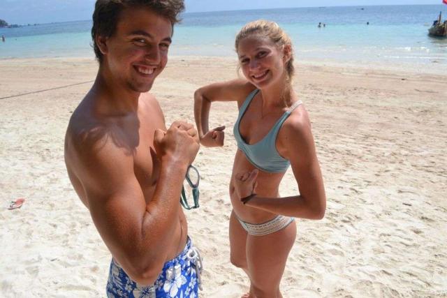 Teenage travelers have fun on the beach during summer youth program in Southeast Asia