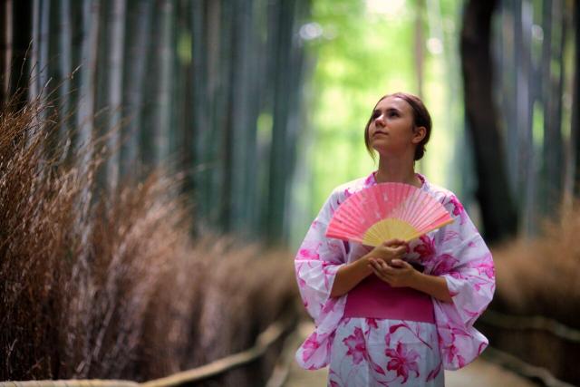 Teen poses in a traditional kimono on a high school program to Japan.