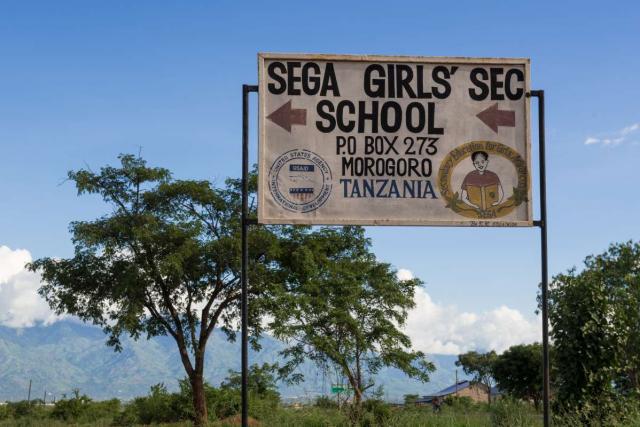 Sign for the SEGA Girls' School where teens spend part of their summer service program in Tanzania.