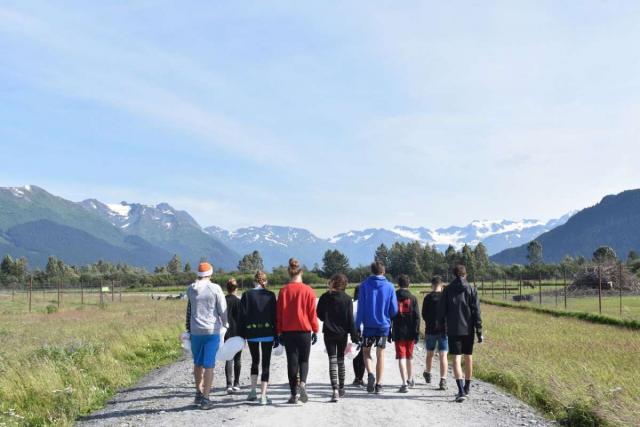 Student group walks in the wild of Alaska on their summer service program.