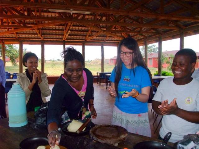 Teens learn how to cook during summer service and travel program in Tanzania.