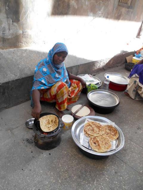 Students try delicious local food on summer teen tour of Tanzania.