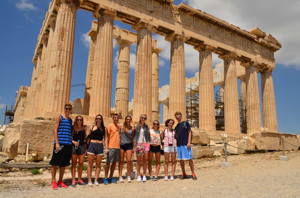 Teenage travelers at Greek Acropolis in Athens during summer youth travel program in Greece