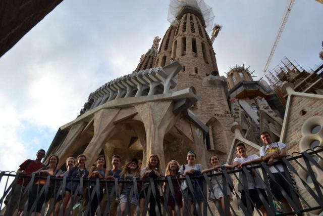 Teen travelers explore Sagrada Familia Barcelona on youth trip to Spain
