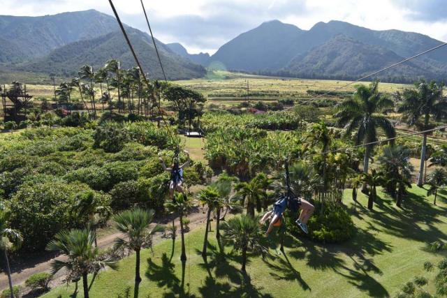 Students zip-line in Hawaii on summer teen service program.