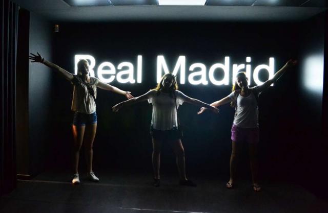 Teenage travelers at Santiago Bernabeu Football Stadium in Madrid during summer youth travel program