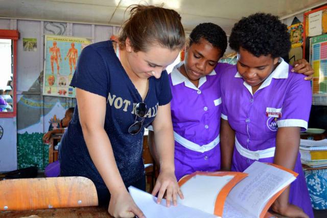 High school traveler works with local students on their service program to Fiji.