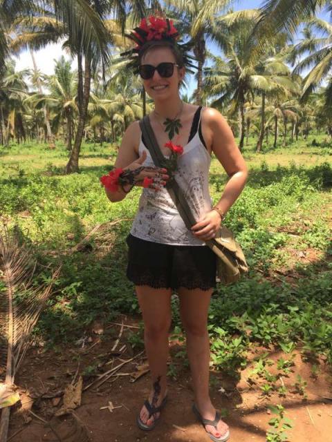 Teen wears flowers and henna in Zanzibar during summer service and travel tour of Tanzania.