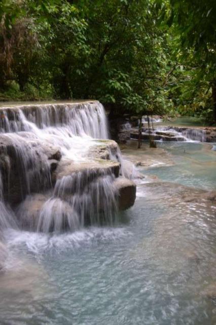 View of waterfalls in Laos seen by teenage travelers during summer youth program in Southeast Asia