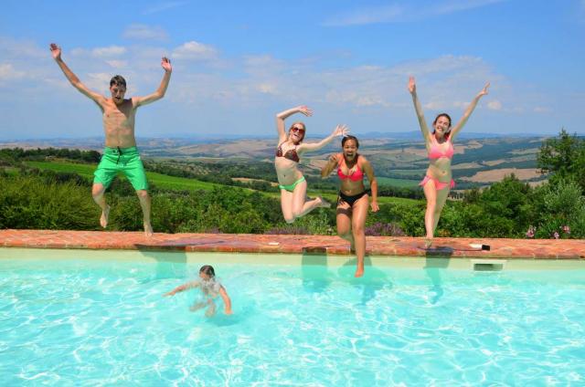 Students dive into the summer at a villa in Tuscany on their summer teen tour to Italy.
