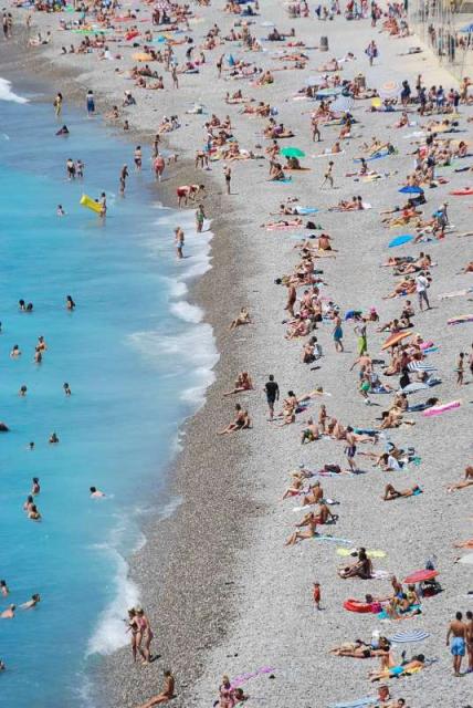 French Riviera Beach visited by teenage travelers on summer youth travel program in France