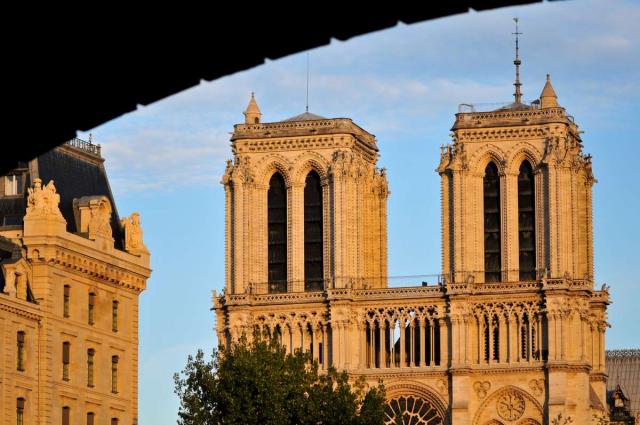 View of Notre Dame Cathedral at sunrise seen by teens on summer youth travel program in Paris