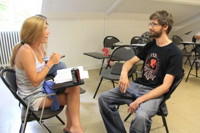 American teenager learning French at language academy during summer immersion program