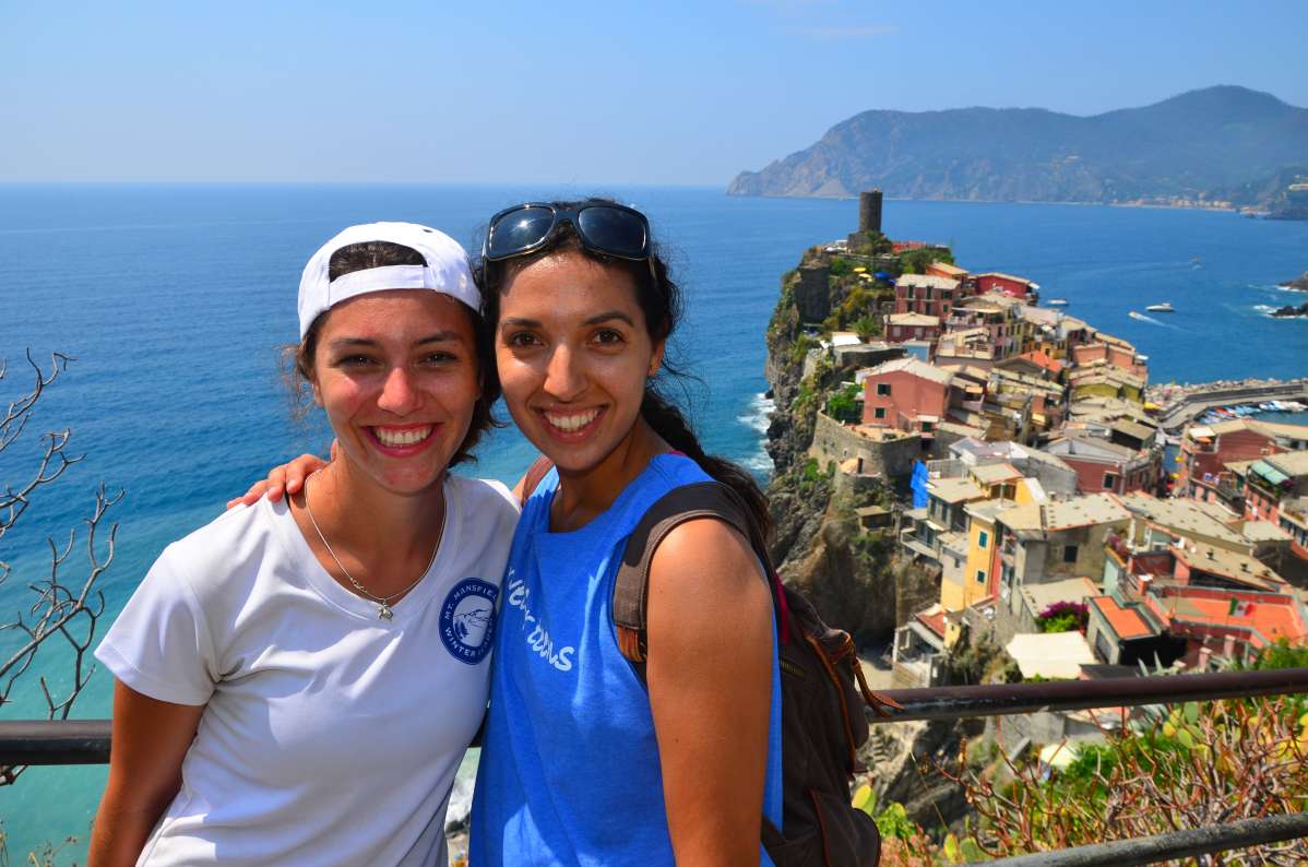 High school teens hike the Cinque Terre and pose with the stunning vistas in Italy on their summer program.