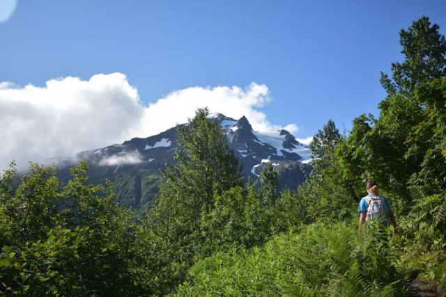 Teen traveler exploring Alaska wilderness on summer youth travel program