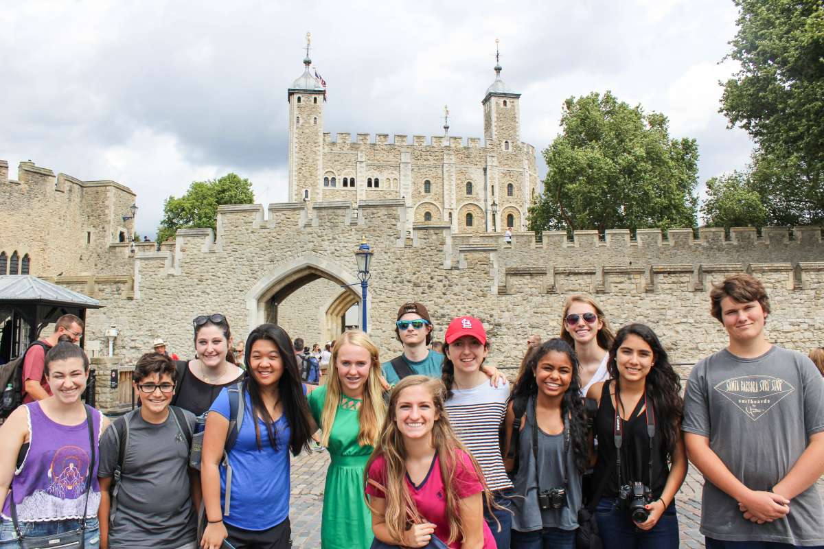 Group of teen travelers at Tower of London during summer youth travel program