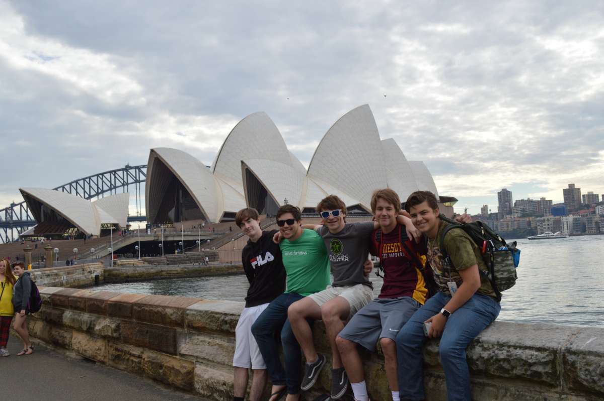 High school student traveler in front of the Sydney Opera House on their teen tour Down Under.