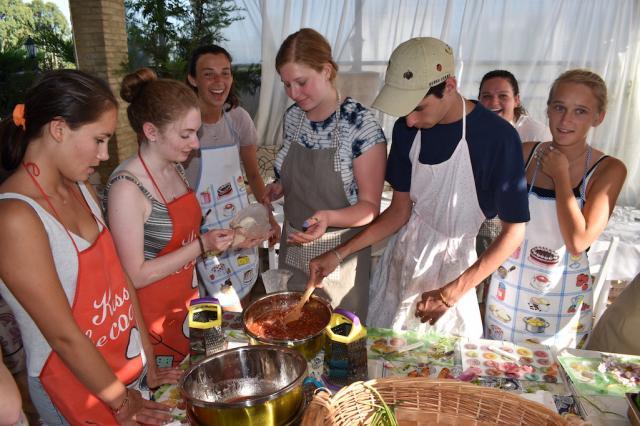 High school travelers try their hand at Greek cooking on the island of Lefkada in Greece on their teen tour.