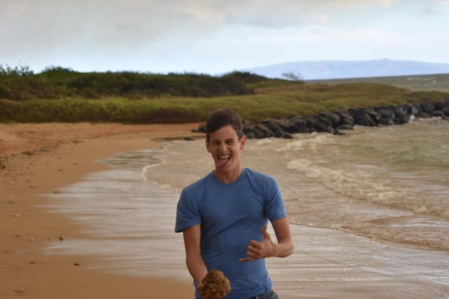 A teen has some fun by the water on a summer student travel program in North America.