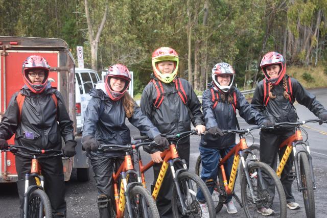 A group of teens goes mountain biking in Hawaii on their summer travel tour.