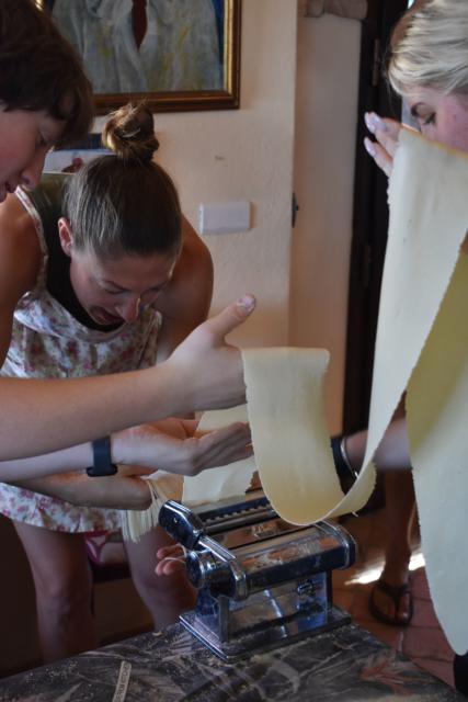 Teens make pasta in Italy