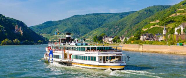 Touristic cruise passenger motor ship boat and vineyards in Ruedesheim am Rhein Rhine, Rudesheim, Rheingau-Taunus-Kreis, Darmstadt, Hessen, Germany
