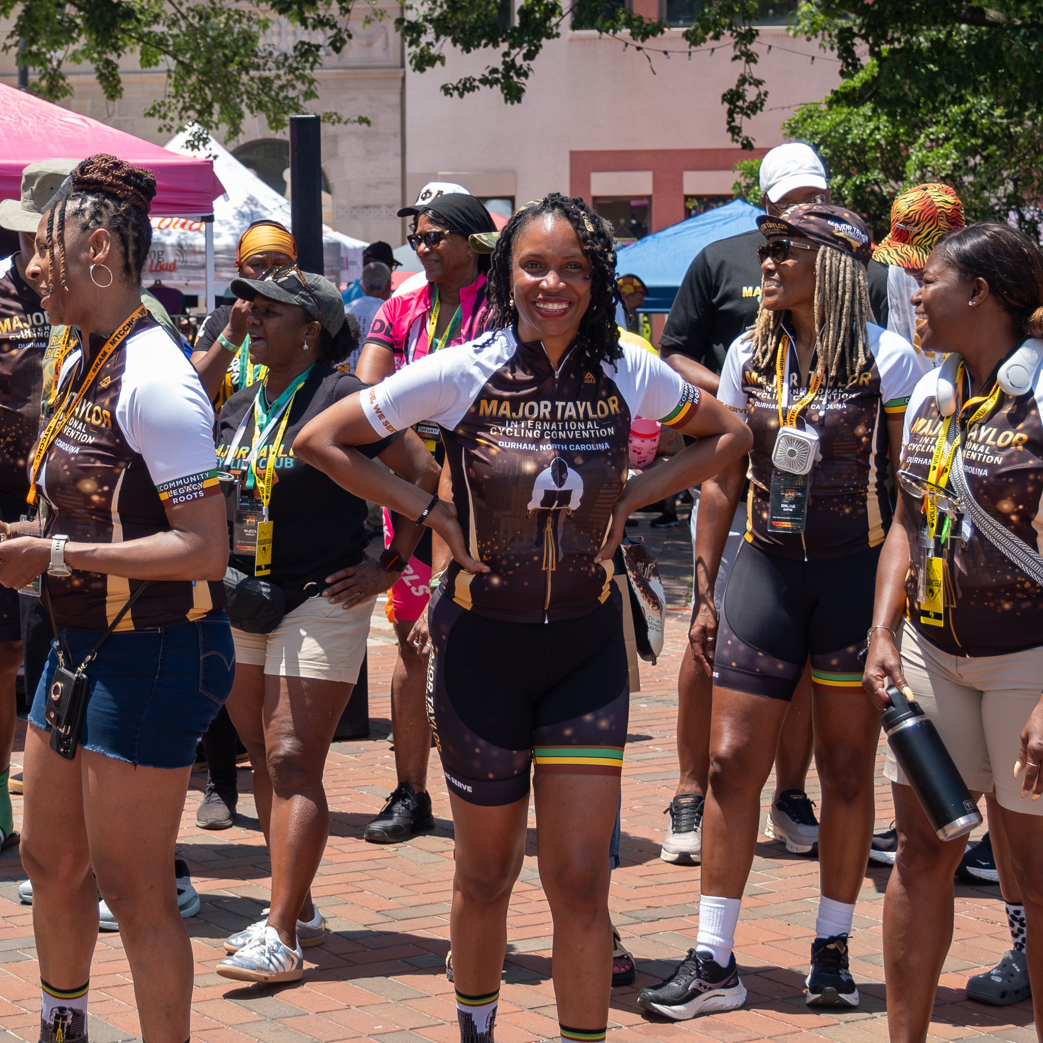 Riders in convention kit together in downtown Durham