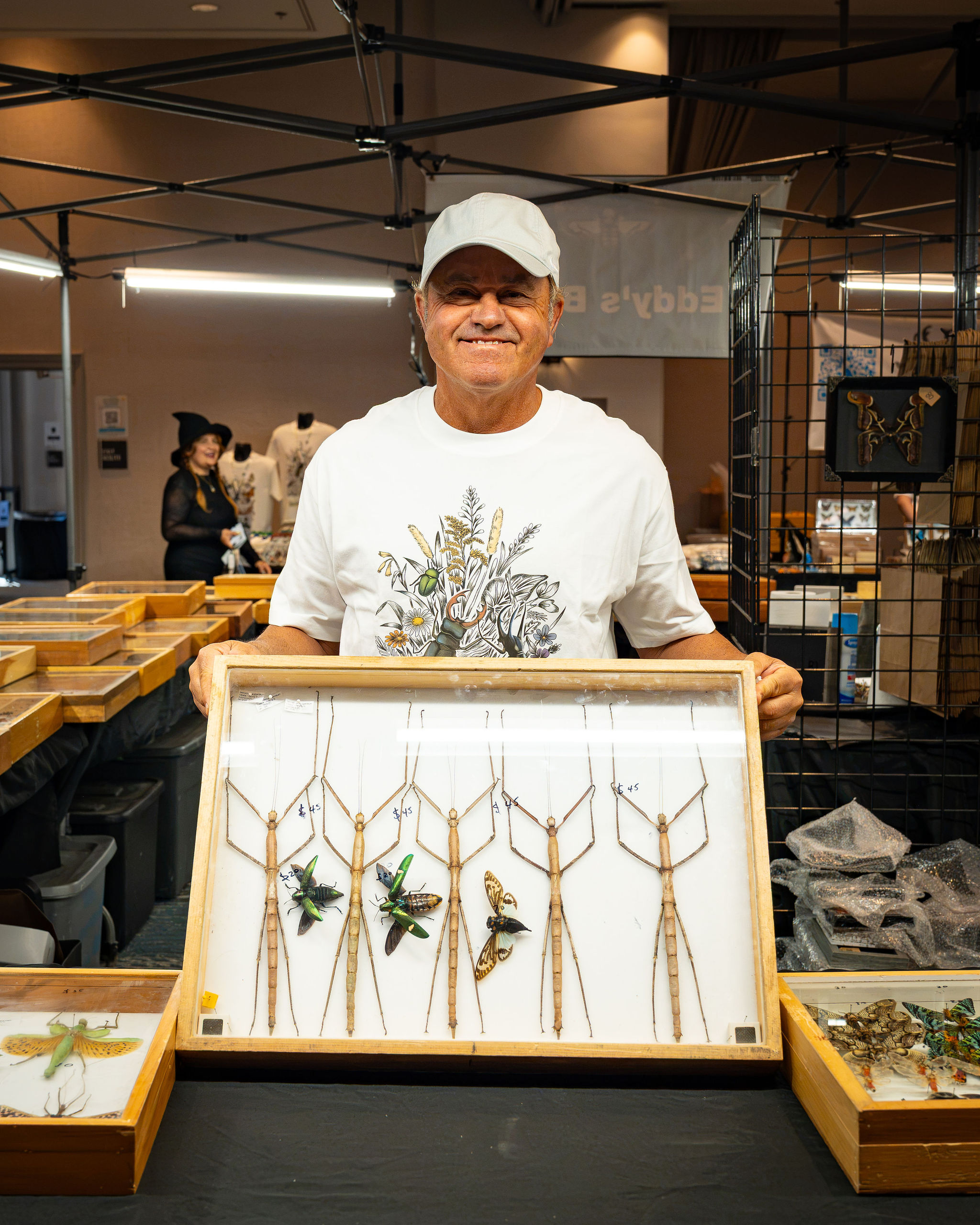 Visitors exploring a vendor display at BUGTOPIA