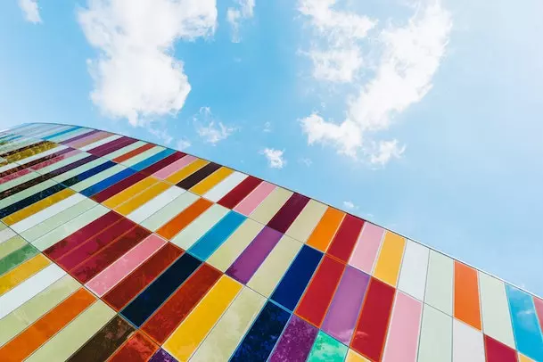 rows and rows of colorful tiles in front of blue skies