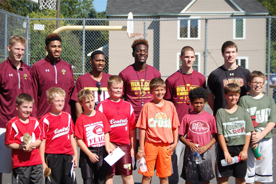 Rookie basketball boy's team on an outdoor basketball court