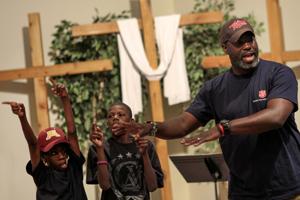 Antwan Flowers leading worship at the St. Paul Payne. Ave. Salvation Army