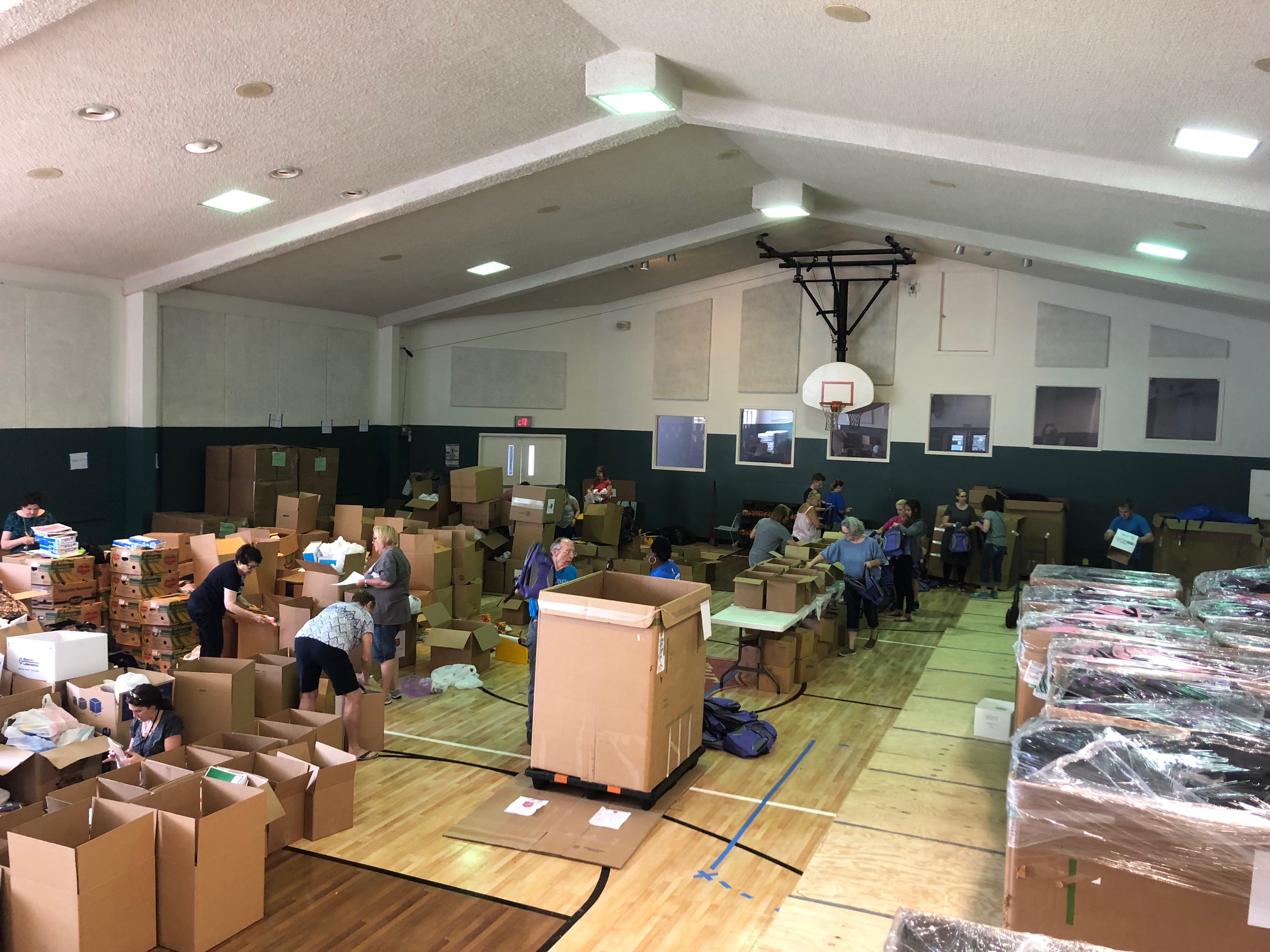 Volunteers Donate Their Time Stuffing Backpacks for Kids in Need The