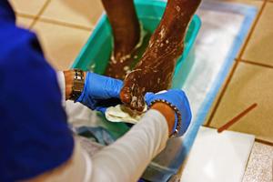 Nursing student cleans homeless person's feet