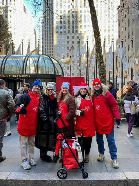 Echelon members ringing bells at the Red Kettle Takeover in Rockefeller Plaza.