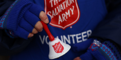 Salvation Army volunteer holding a bell