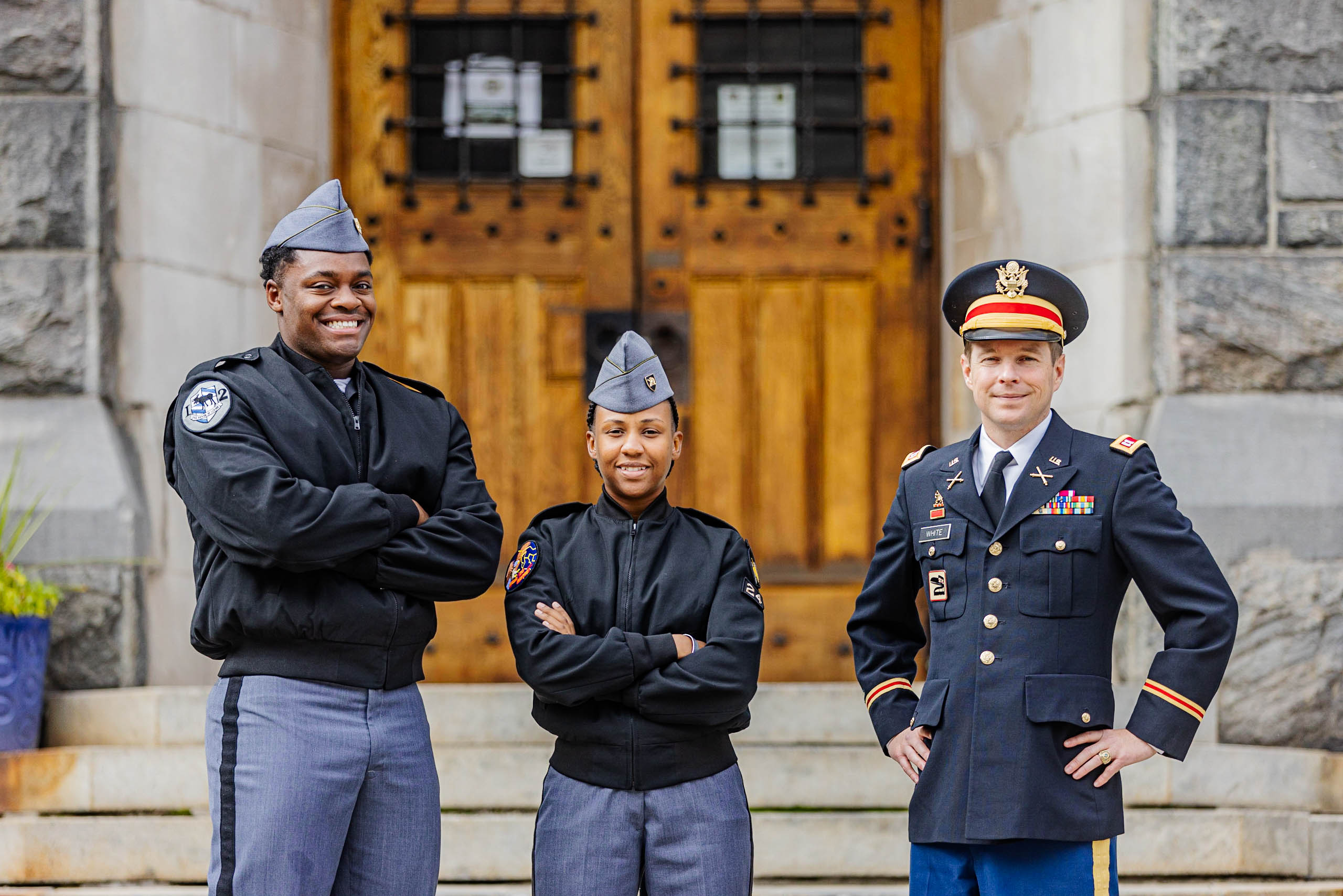 Cadets Ronald Taylor, Shari-Lee Bennett and Director of the Soldier Admissions Program Capt. White stand in front of the West Point Admissions building in front of the U.S. Military Academy.