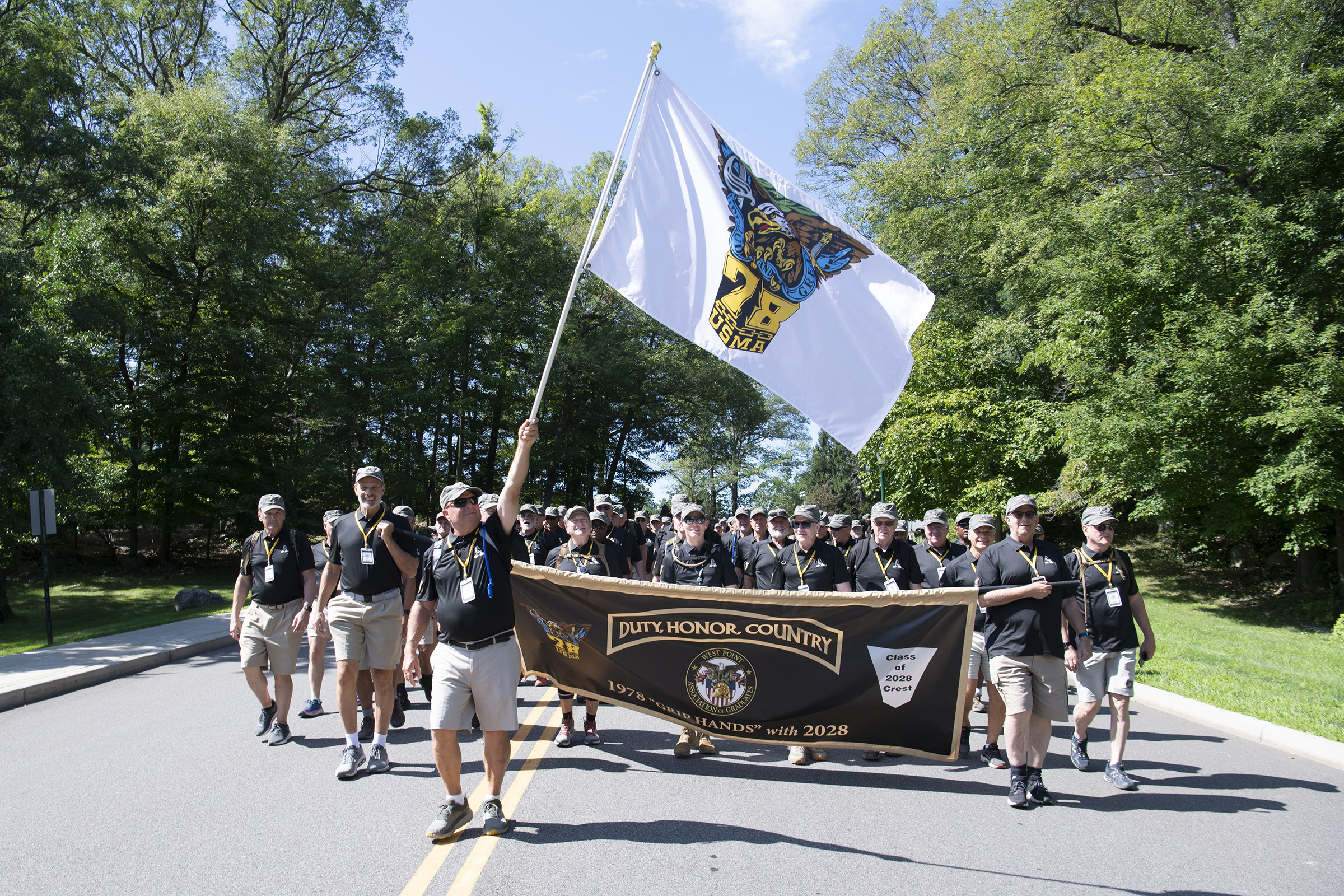 The U.S. Military Academy Class of 2028 completes its Cadet Basic Training with March Back on Aug. 12 at West Point. The new cadets marched 14 miles from Camp Buckner to the Victor Constant Ski Slope where they had a brief respite before making their final journey to the Superintendent's house to finish the march. They were accompanied by several graduates on the route, including many from their 50-year affiliate class, the Class of 1978. (Photo by John Pellino/USMA PAO)