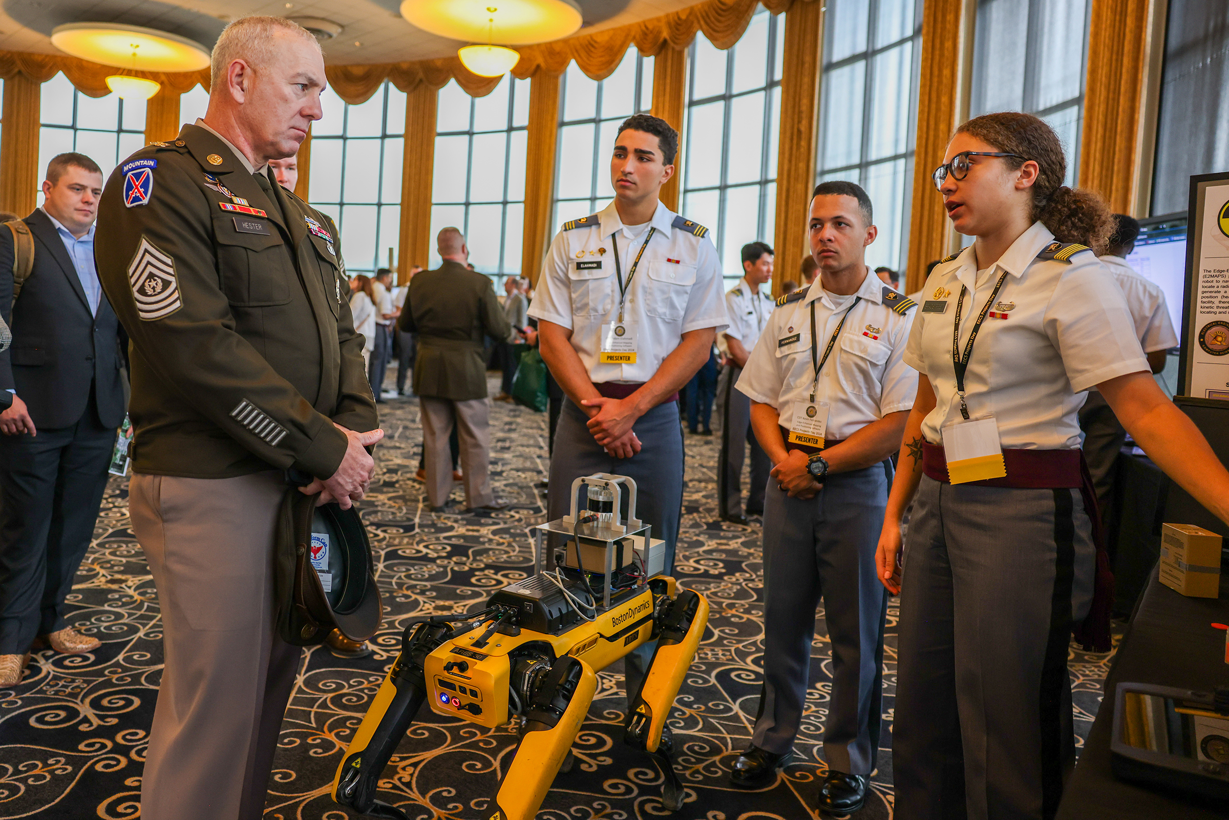 Command Sgt. Maj. Brian Hester, Army Futures Command, receives a cadet briefing during the United States Military Academy’s annual Projects Day Research Symposium at West Point, N.Y., on May 2. This year’s symposium had over 450 projects presented in varying stages of development on topics ranging from rocketry to artificial intelligence. (U.S. Army photo by Sgt. 1st Class Alan Brutus)