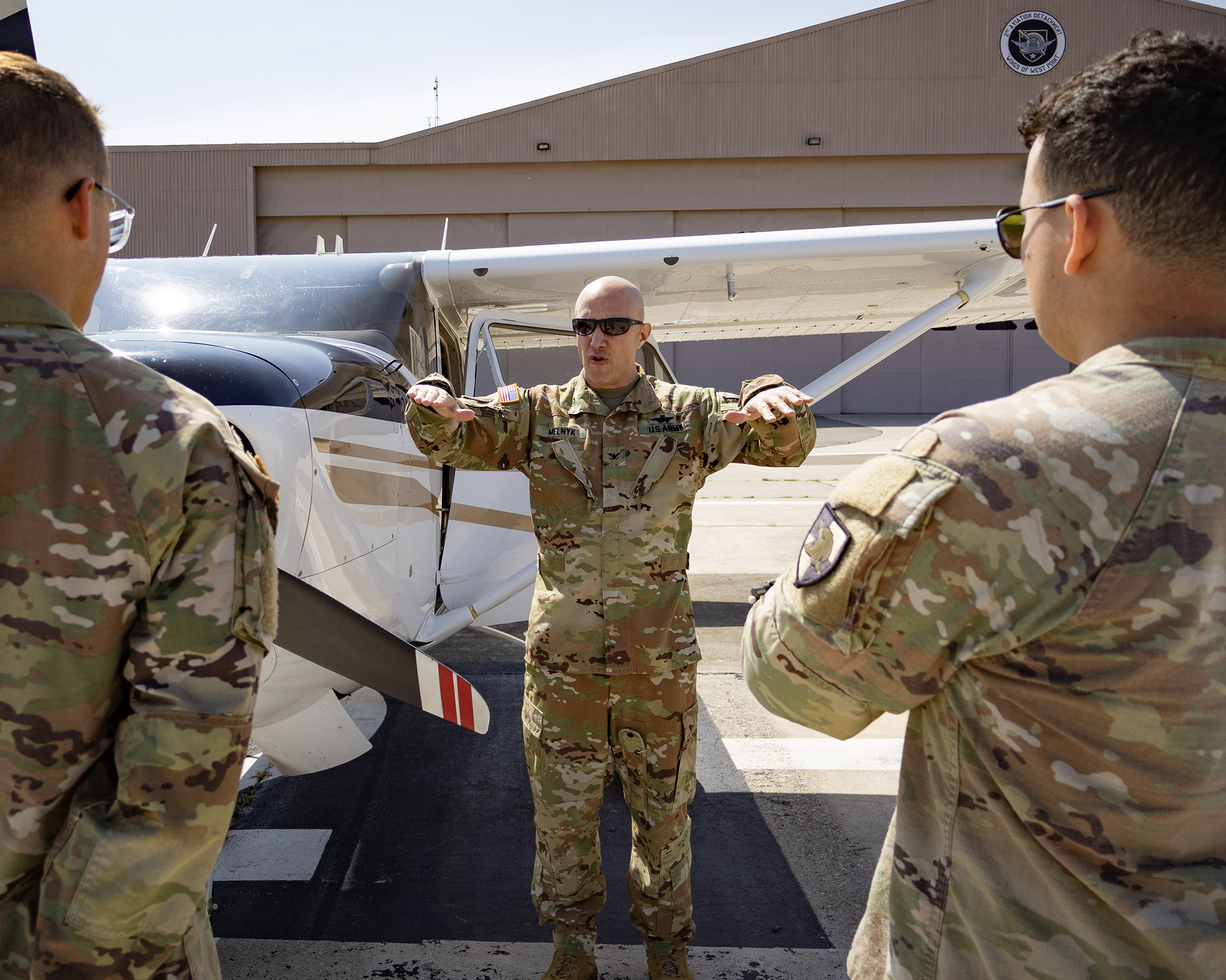 Col. Rich Melnyk explains aircraft flight controls and stability prior to executing a flight laboratory with cadets.  (Photo by U.S. Military Academy PAO) 