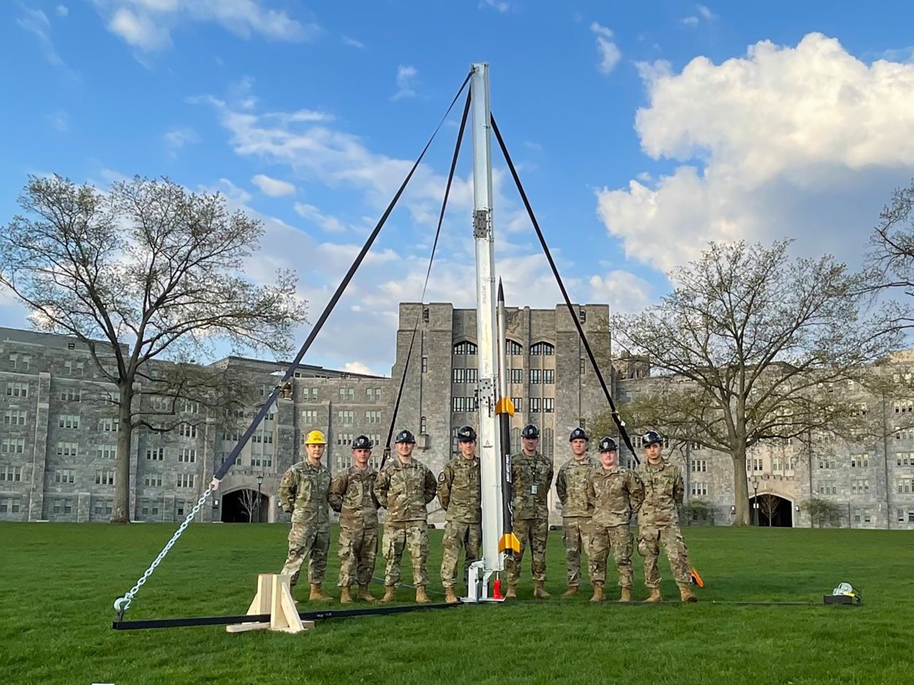 Cadets from the Hypersonic Rocket Team pose with their two-stage rocket. (Photo Credit: courtesy photo from the Department of Civil and Mechanical Engineering)