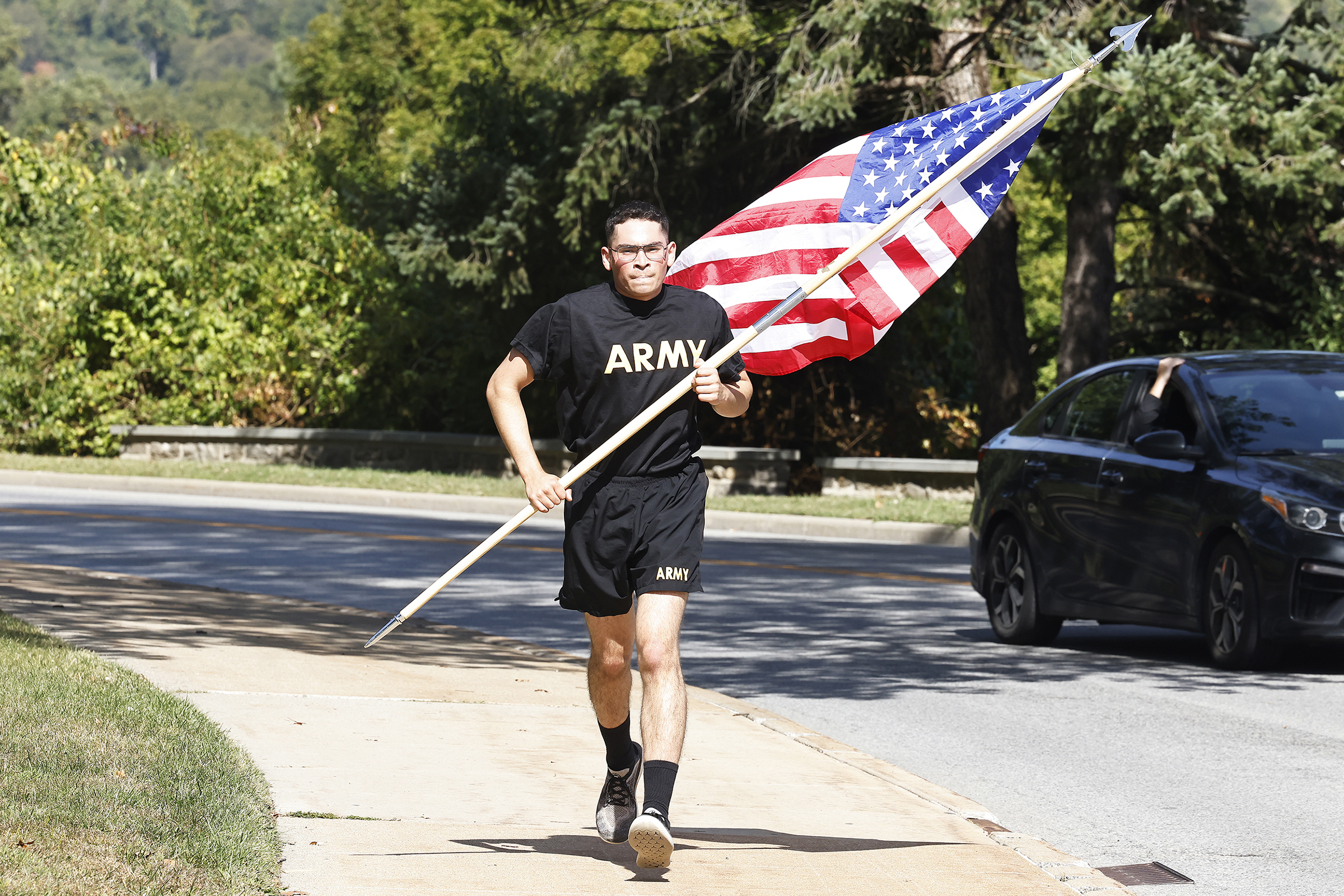 Members of 2nd Battalion, 4th Regiment of the U.S. Military Academy Corps of Cadets commemorated the victims of the 9/11 terrorist attacks in 2001 by running the American Flag throughout Central Area to the West Point Cemetery and back throughout the day on Sept. 11 at West Point.  (Photo by Eric S. Bartelt/USMA PAO)