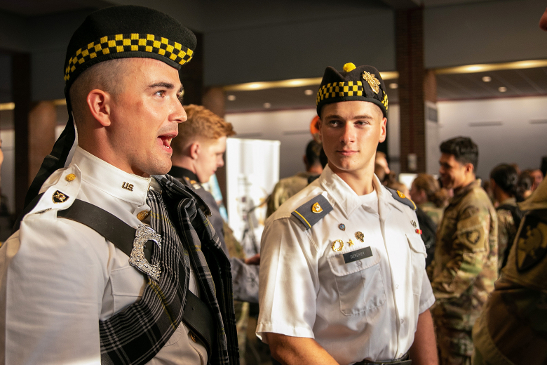 Members of the Pipes and Drums club speak to prospective cadet members during the annual Club Night event Aug 16 at Eisenhower Hall.    															          Photo by Class of 2025 Cadet Noah Murray