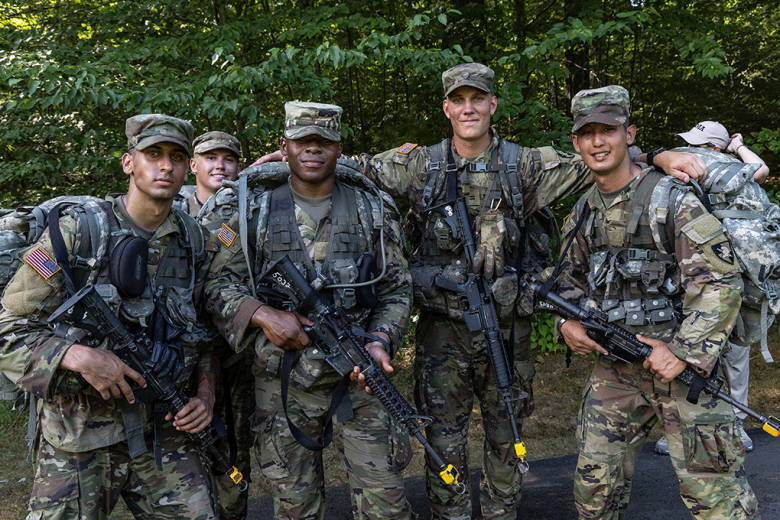 The new cadets take time to pose for a picture and a smile before completing March Back and ending Cadet Basic Training.