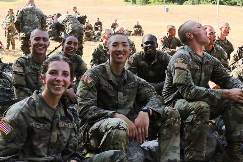 U.S. Military Academy Class of 2026 cadets take a rest before completing the 12-mile road march, also known as March Back, at the West Point Ski Slope. 