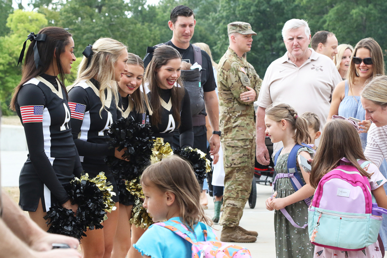 West Point Elementary School students return for the first day of school after a long summer on Monday. The students were greeted by several people including their teachers and the Rabble Rousers (bottom left), who motivated the children as they walked into the school.     			       															                    Photos by Capt. David Hoy/USMA PAO