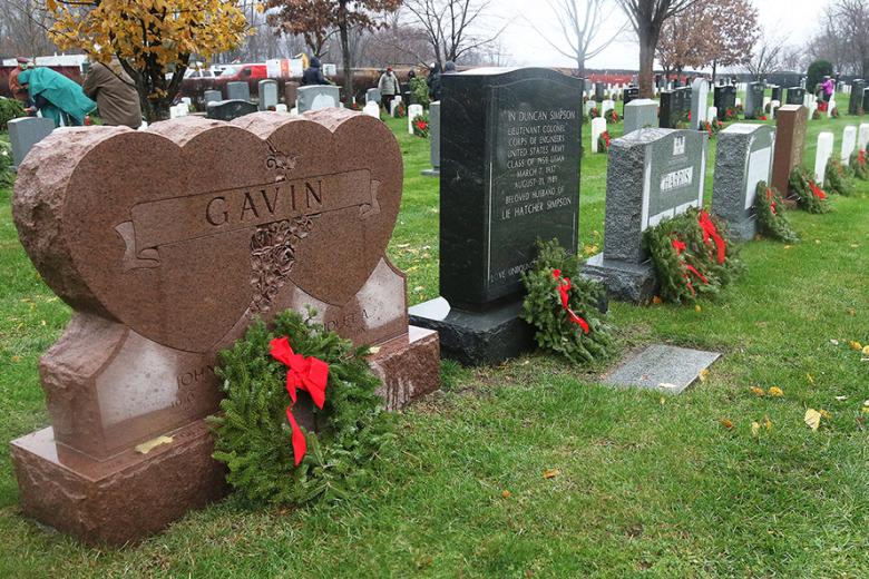 Despite the wet, windy conditions, about 80 volunteers showed up to honor and remember the West Point graduates, their family members and others buried at the West Point Cemetery for the 11th annual West Point Wreaths Across America event Saturday. This year, 7,050 wreaths were laid at each headstone through the generosity of several donors who give through the Wreaths Across America. Since 1992, Wreaths Across America has been committed to teaching younger generations about the value of their freedoms