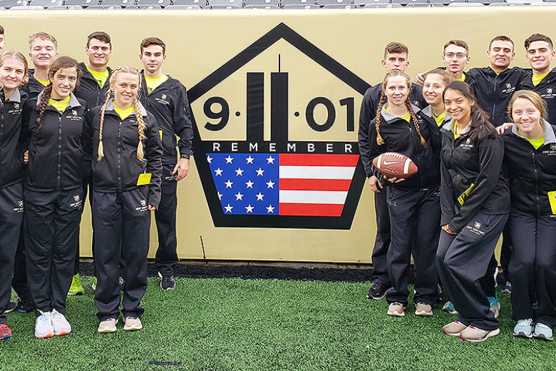 The Army West Point football team entered the field carrying American flags (top and above right) and the Army West Point Marathon team (above left) took a photo in front of the 9/11 ʽNever Forgetʼ sign prominently displayed in order to pay homage to those affected 20 years ago at the 122nd annual Army-Navy Game Saturday at MetLife Stadium in East Rutherford, N.J. 
