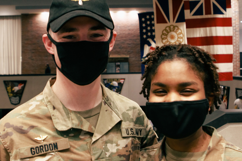 Class of 2022 Cadets John Gordon (left) and Cameryn Smith (right) pose for a photo after receiving their branch notification during Branch Night Dec. 2 at Eisenhower Hall Theatre.  